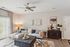 Chic living room featuring modern decor, plush seating, and natural light with a serene color palette.