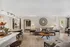 Chic living room with modern decor, cozy seating, and warm lighting, perfect for relaxation and entertaining.