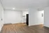Modern apartment featuring open-concept layout with stylish wood flooring and a pristine kitchen.