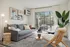 Chic and inviting living room with modern decor, featuring a plush gray sofa, stylish art pieces, and large window for natural light.