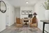 Modern, inviting home office space with sleek wooden desk, two stylish leather chairs, and minimalist decor.