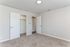 Bright and inviting bedroom with plush carpet and ample closet space, ideal for comfortable living.