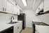 ReNew WestGlen Modern Kitchen with Black Appliances and White Cabinetry
