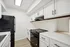 ReNew WestGlen Modern Kitchen with Black Appliances and White Cabinetry