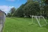 Inviting green space with soccer goals, perfect for outdoor activities and relaxed gatherings.