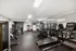 Modern fitness center featuring state-of-the-art treadmills and strength training equipment, perfect for active living.