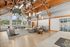 Spacious and elegant community lounge with high ceilings, modern lighting, and stylish seating, perfect for social gatherings and relaxation.