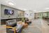 Modern lounge area with sleek leather chairs, stylish decor, and large windows offering natural light.