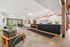 Modern apartment lobby with stylish seating, sleek reception desk, and ample natural light at Arrive Eden Prairie.