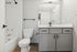 Modern bathroom with sleek fixtures, elegant vanity, and bright lighting.