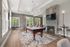 Elegant community lounge with a stylish pool table, cozy fireplace, and modern decor, perfect for social gatherings.