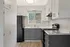 ReNew Miramonte Kitchen with White Cabinetry and Sleek White and Gray Cabinetry