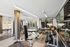 Modern apartment gym featuring state-of-the-art fitness equipment, sleek design, and ample space for a complete workout experience.