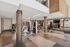 Modern, well-equipped gym with state-of-the-art exercise machines, free weights, and mirrored walls for a comprehensive fitness experience.