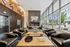 Luxurious lobby with modern seating, elegant artwork, and large windows offering scenic city views.
