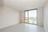 Modern living space with large windows offering stunning city views and abundant natural light.