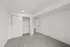 Bright and spacious bedroom with plush carpet, double closet doors, and modern recessed lighting.