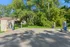 Serene outdoor space featuring vibrant greenery and convenient vacuum stations, ideal for peaceful and practical living.