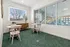 Bright and inviting room with elegant decor, modern furnishings, and large windows showcasing scenic outdoor views.