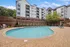 Arrive Fort Lee Pool Area with Lounge Chairs and BBQ