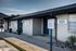 Welcoming leasing office at Alturas with future resident parking, showcasing modern design with clean lines and inviting entry.