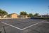 Charming residential community featuring a spacious outdoor basketball court surrounded by greenery and modern apartments.