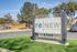 Inviting sign of reNew at Polo Parkway surrounded by lush greenery, showcasing a serene neighborhood vibe.