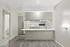 Inviting apartment kitchen with modern white appliances, sleek countertops, and a bright, open layout perfect for entertaining.