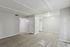 Modern open-concept living space featuring elegant wood-style flooring and abundant natural light.