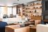 Stylish and inviting living room boasting cozy seating, elegant decor, and open shelving for a modern touch.