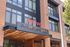 Chic exterior of Arrive Union Wharf Apartments with modern architectural details and inviting entrance.