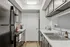 Sleek kitchen design featuring modern cabinetry, stainless steel appliances, and elegant countertops for a stylish culinary experience.