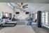 Modern fitness center with state-of-the-art equipment, high ceilings, and motivational decor, perfect for an energizing workout.