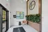 Inviting lobby space with modern art, sleek greenery, and sophisticated decor, embodying a welcoming atmosphere.