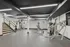 Modern fitness center featuring state-of-the-art exercise equipment, sleek flooring, and ample natural light for an invigorating workout experience.