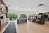Modern and inviting open-concept office space with elegant seating, natural light, and a stylish kitchenette.