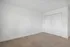 Bright and spacious bedroom featuring plush carpet and a large double closet, perfect for ample storage.