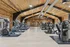 Spacious and modern fitness center with state-of-the-art equipment and elegant wooden ceiling, perfect for an invigorating workout.