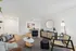 Modern living room with chic decor, featuring a stylish leather sofa, elegant dining area, and bright, open space perfect for entertaining.