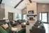 Inviting modern lounge area with cozy seating, stylish fireplace, and chic decor, perfect for relaxation.