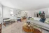 Inviting modern living room with plush seating, stylish decor, and natural light, perfect for relaxation and entertaining.