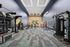 Modern gym with high ceilings, sleek equipment, and bright lighting, perfect for a dynamic workout experience.