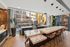 Chic modern kitchen with sleek marble countertops, high-end appliances, and floor-to-ceiling windows offering stunning city views.