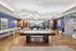 Modern recreational room with a sleek pool table, elegant lighting, and stylish seating area, ideal for entertainment and relaxation.