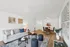 Contemporary living room with elegant decor, stylish furniture, and a cozy dining area showcasing modern aesthetics.