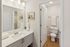 Elegant bathroom featuring a sleek vanity with ample counter space, modern fixtures, and tasteful decor.