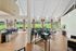 Bright, inviting open-concept living area featuring modern furnishings, ample natural light, and scenic outdoor views.