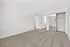 Spacious and inviting bedroom with plush carpeting, mirrored closet doors, and ample natural light.