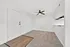 Bright and inviting entryway with modern ceiling fan, featuring a perfect blend of carpet and hardwood flooring.