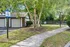 Charming apartment community offering a scenic path leading to a well-maintained dog park, perfect for pet lovers.